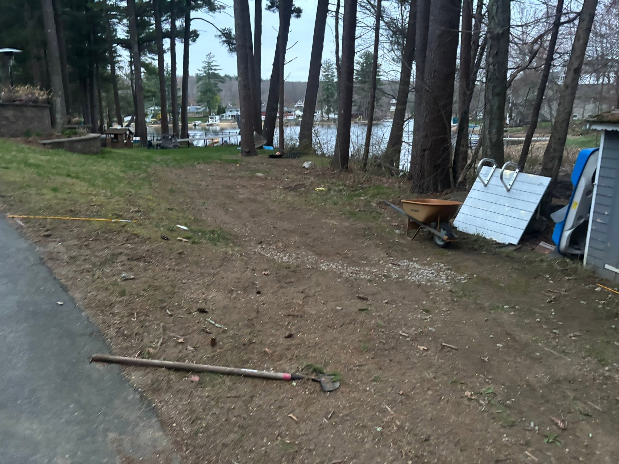 Cracked concrete pad before removal in Spencer, MA backyard